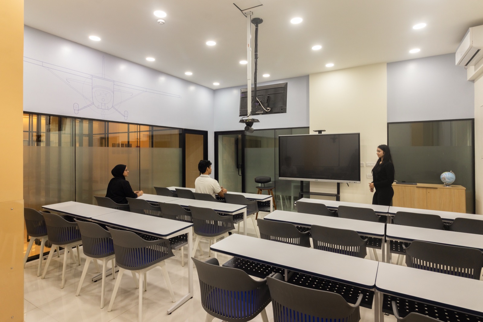 DGCA ground class in session with instructor teaching students in a modern classroom