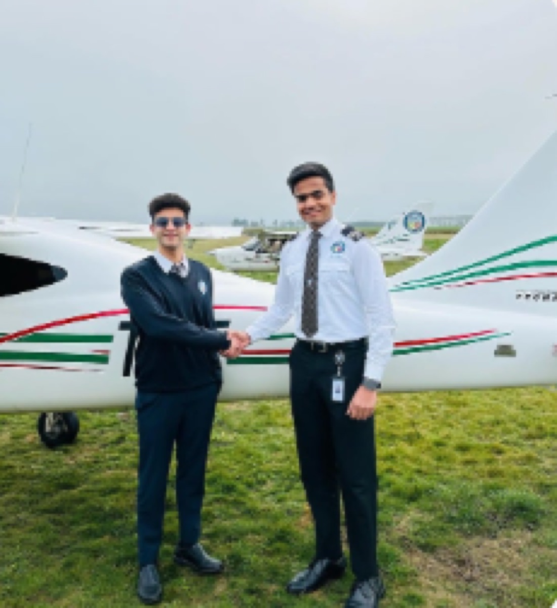 ThePilot.in cadets celebrating CPL completion beside a training aircraft