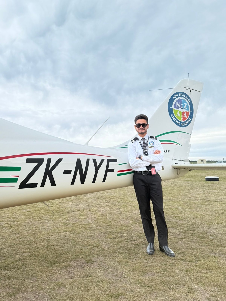 ThePilot.in cadet beside a New Zealand Airline Academy Tecnam ZK-NYF trainer