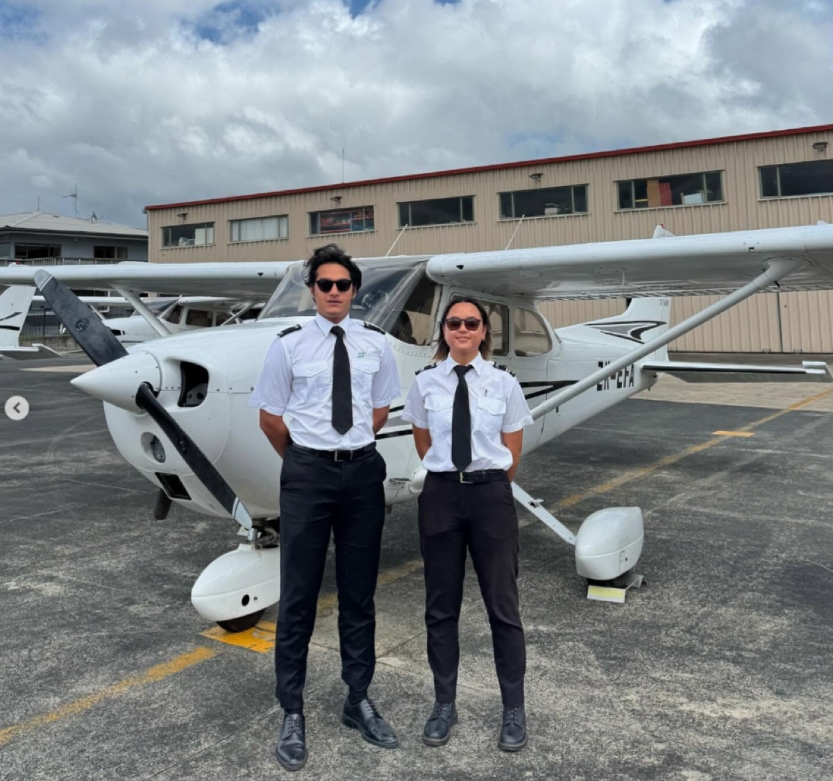 ThePilot.in cadets in pilot uniform beside a Cessna trainer at a New Zealand partner flying school