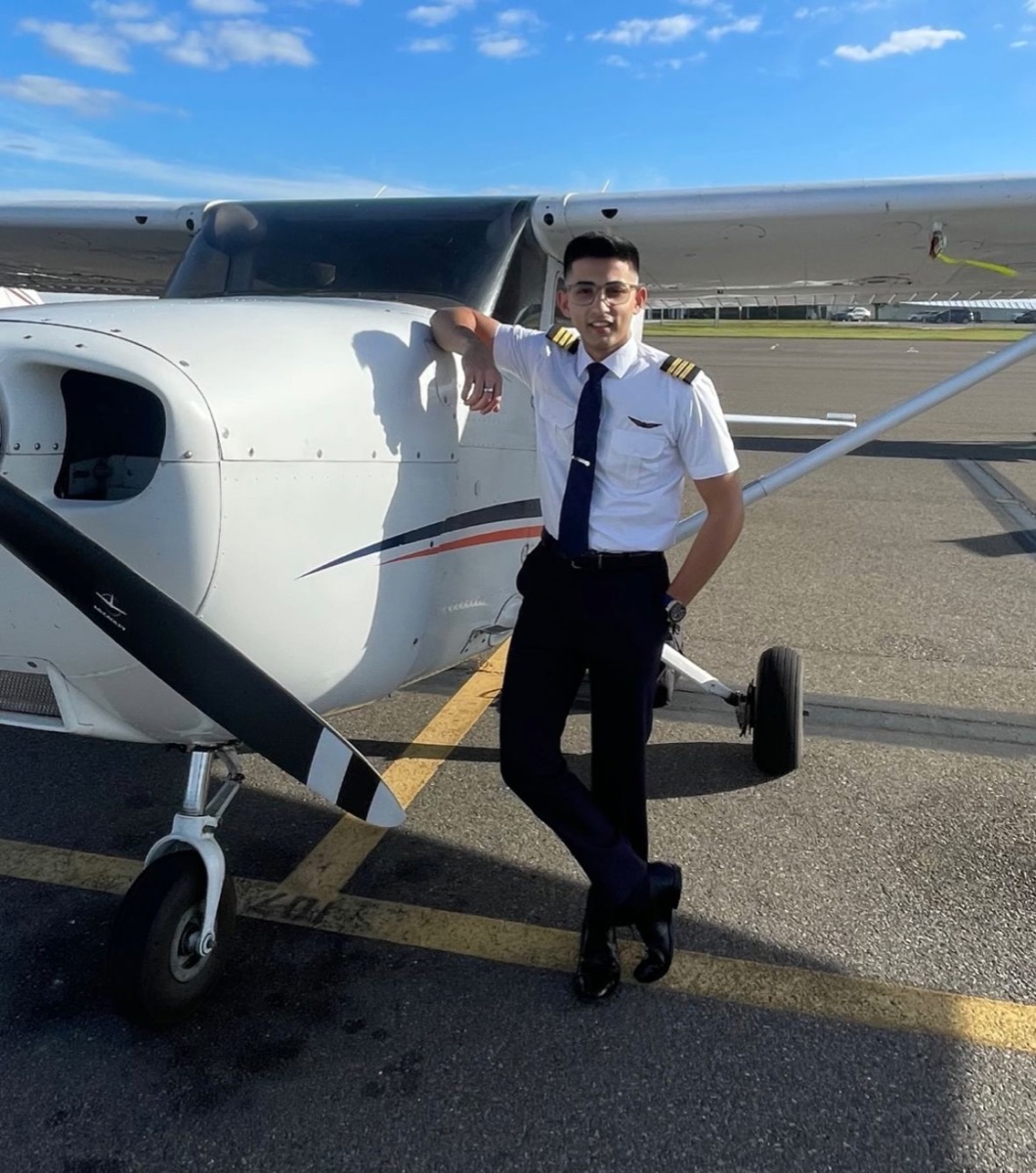 ThePilot.in student pilot on a Cessna trainer giving a thumbs up after a solo flight